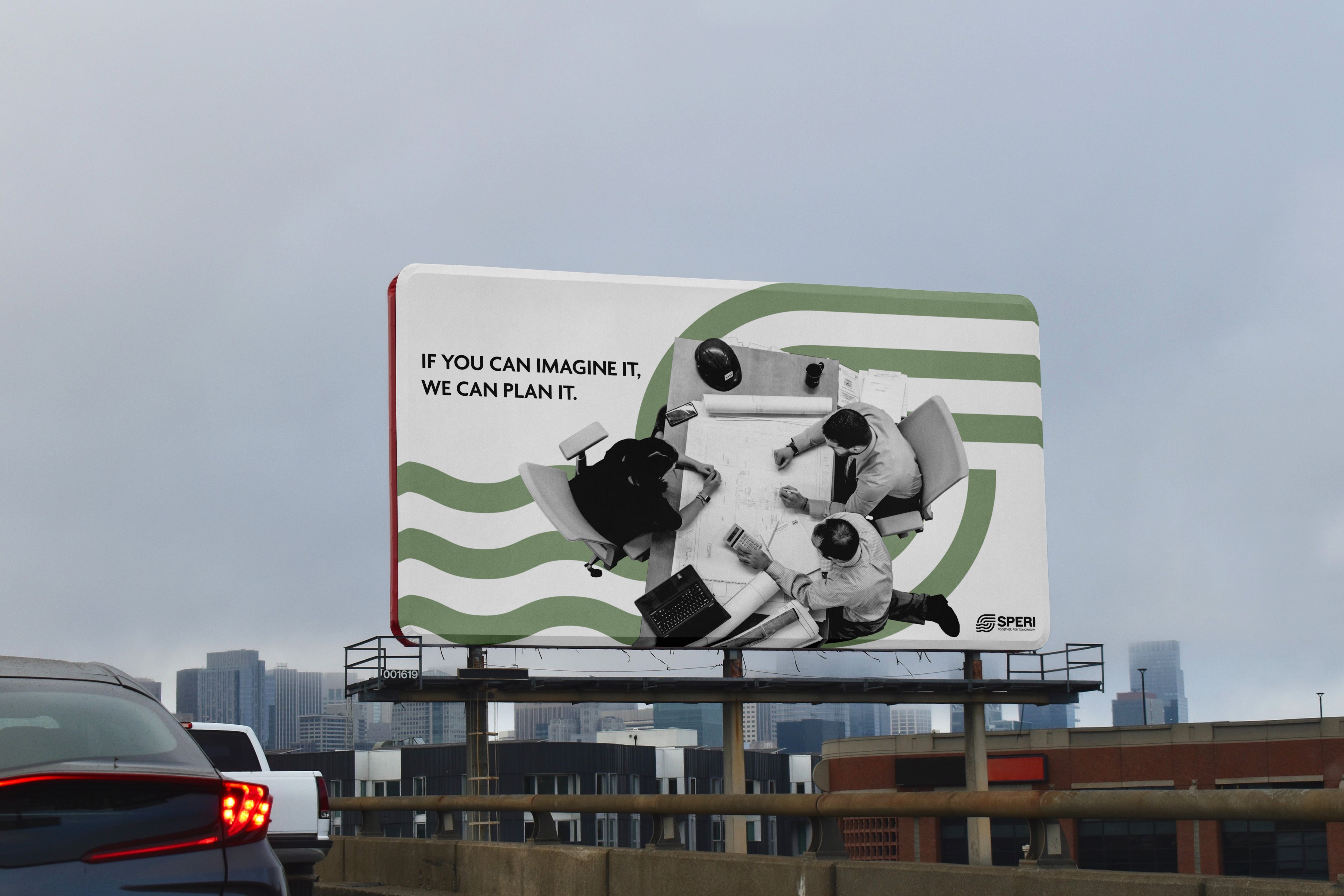 Cartellone stradale: «If you can imagine it, we can plan it», con le onde verdi